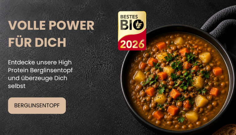 Bio-Linsensuppe mit Gemüse in einer Schale, ansprechend angerichtet. Das Bestes Bio 2026-Siegel ist zu sehen.